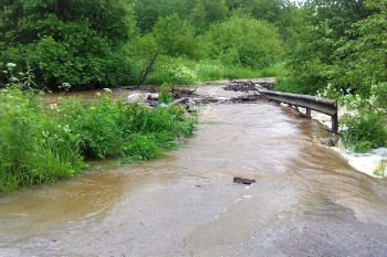 Затопленный мост, шофер умер за рулем, в область идет потепление и другие новости выходных